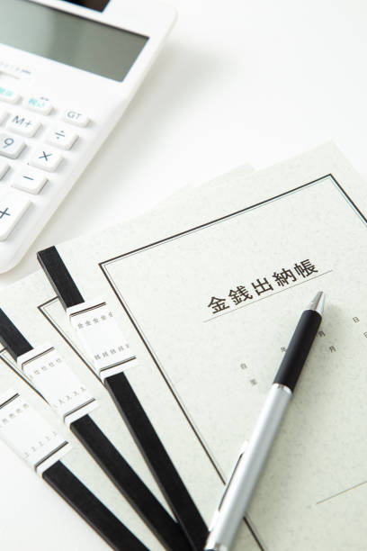 istock Cash book and calculator on a white background. 1678306031