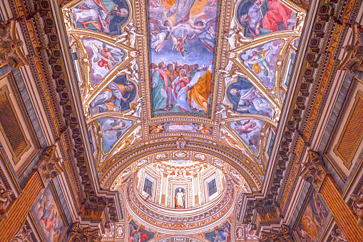 Rome, Italy - September 8, 2023: Interior of the baroque church of Santa Maria ai Monti in the historic center of Rome, Italy, built in 1603. The dome and part of the fresco on the ceiling of the central nave.
