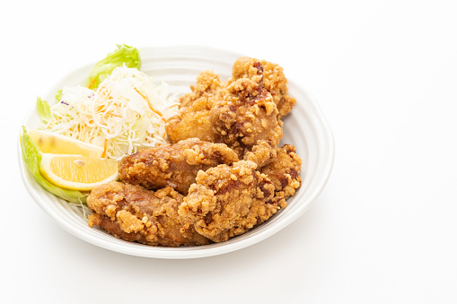 Delicious fried chicken on a white background.