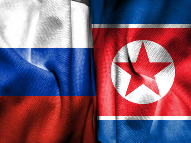 istock Russian flag and North Korean flag composed with cloth pattern. Concept map depicting a 2023 meeting between the two leaders. Basemap and background concept. Double exposure hologram. 1678327594