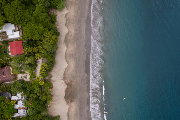 Beautiful aerial view of Playas del Coco, Hermosa Beach and its green mountains, bay and yachts in Costa Rica Beautiful aerial view of Playas del Coco, Hermosa Beach and its green mountains, bay and yachts in Costa Rica el coco stock pictures, royalty-free photos & images