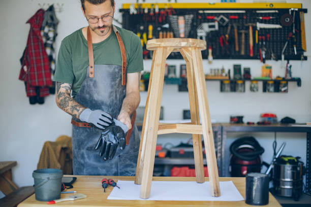 istock Craftsman putting on protective gloves 1678331171