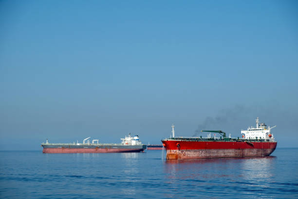 istock Container cargo ship loaded leaves Piraeus port Greece. Smoke from ship chimney, moored vessel, sea. 1678335801
