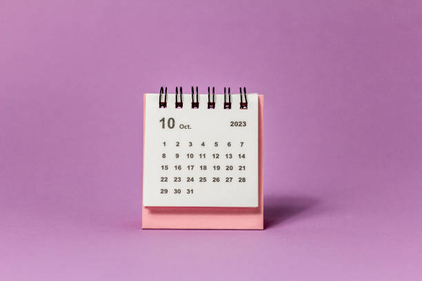 istock October 2023. Monthly desktop calendar for 2023 on a pink background. 1678353389