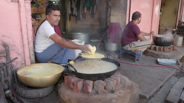 Indian street vendor preparing a snack - bhujia, Jaipur