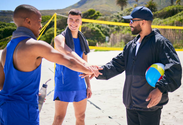 istock Happy man, volleyball and hands together on beach in motivation, teamwork or training in fitness. Excited male person piling in team sports, game or support in unity, meeting or goals on ocean coast 1678379599