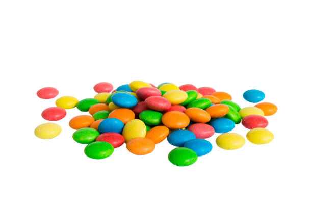 istock Multicolor small mixed colored chocolate coated candies, isolated on white 1678399663