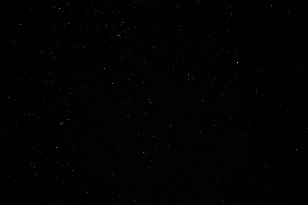 Night sky with bright stars and blue nebula stock photo