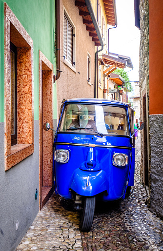 Malcesine, Italy - April 25: typical old Piaggio Ape at the old town of Malcesine on April 25, 2023