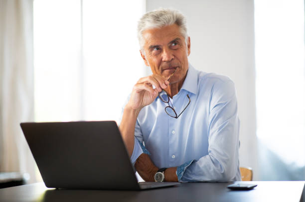 istock businessman sitting at his desk 1678427806