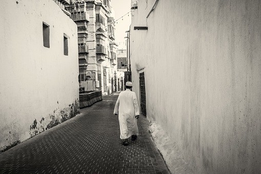 Saudi man walking on the street in the old town of Jeddah Saudi Arabia