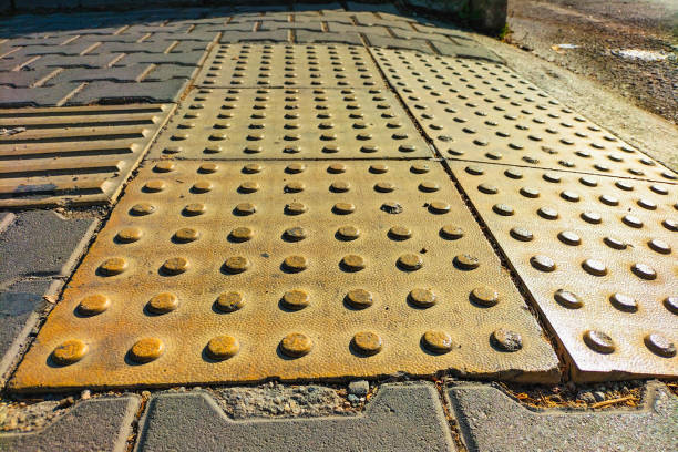 istock Guide textured lines to suggest the correct direction of movement for visually impaired, blind people in wheelchairs or with a pole when crossing highways at pedestrian crossing points 1678446953