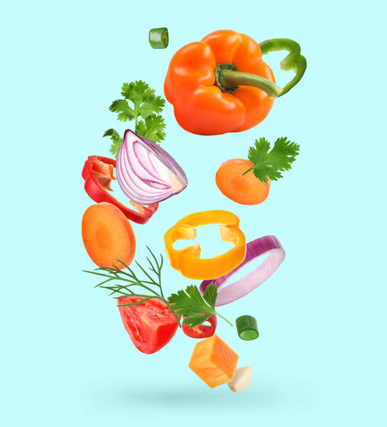 istock Spice mix for cooking. Set of falling fresh vegetables and herbs on light blue background 1678483982