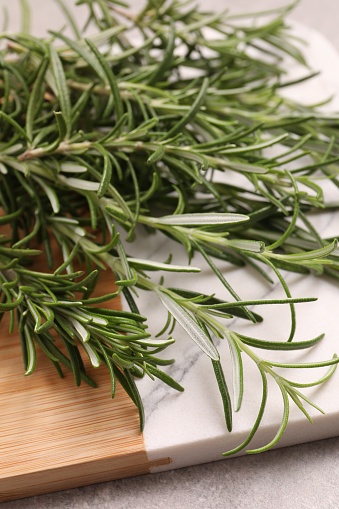 Sprigs of fresh rosemary on table, closeup