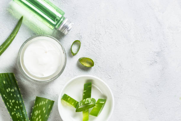 istock Aloe vera cosmetic at stone table top view. 1678494883