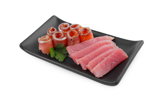 Tasty sashimi (slices of fresh raw tuna and salmon) with parsley isolated on white