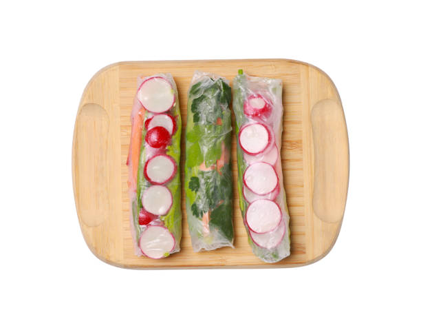 istock Delicious spring rolls wrapped in rice paper isolated on white, top view 1678496039