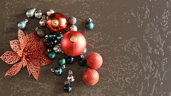 christmas balls of various colors on gray background