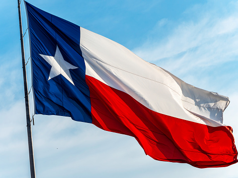 A very large state of Texas flag blowing in the wind