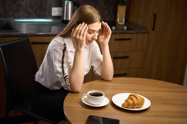 istock Caucasian female lost in thought in modern kitchen 1678559903
