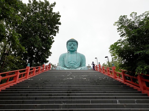 The Great Buddha statue of Wat Doi Phra Chan at the Buddhist temple in Thailand