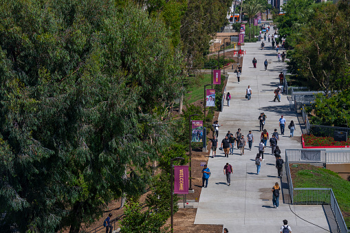 University students walk past the Natural Sciences and Mathematics build on the campus of  Cal State University Dominguez Hills, Carson, USA