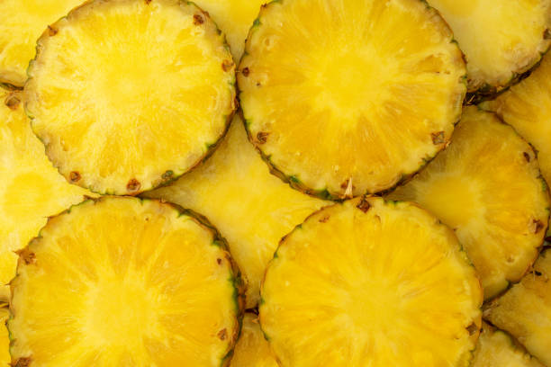 istock Pineapple juicy yellow slices as a background. 1678618289