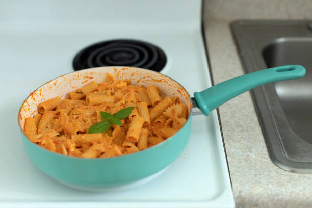 Pasta with homemade tomato sauce, cheese and  garnished with basil