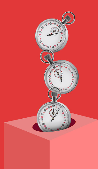 Concept of time. Vintage timer falling into cube on red background
