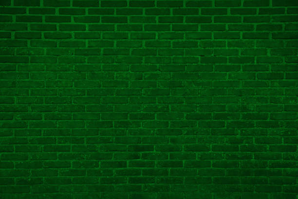 istock Texture of dark green brick wall as background 1678654684