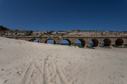 Roman Aqueduct in the beach in Caesarea Israel