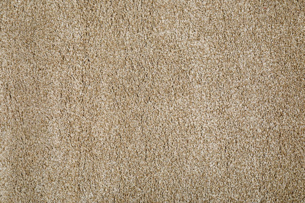 istock Stylish soft beige carpet as background, top view 1678673897