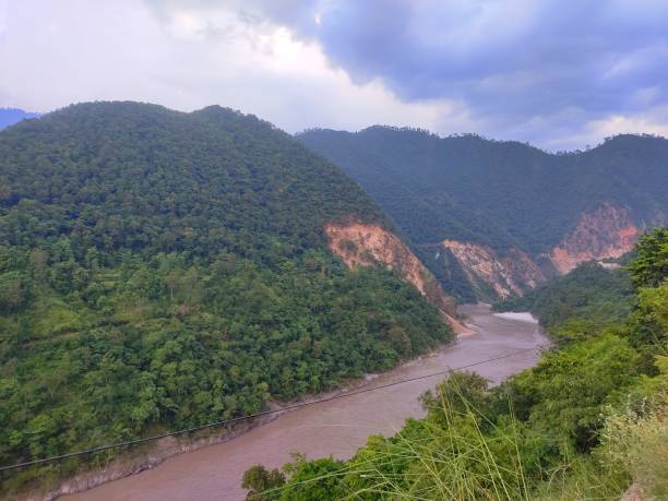 istock Monsoon river flowing through Mountains of Himalayas in India 1678695730