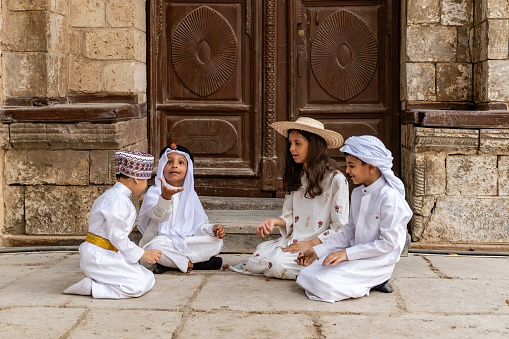 Saudi Arabian kids playing outside the house in Jeddah old town Saudi Srabia