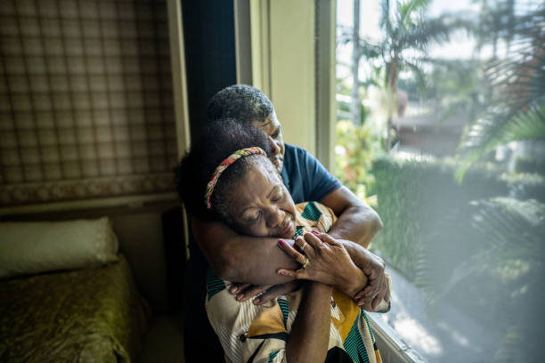 istock Senior couple embracing at home 1678764038