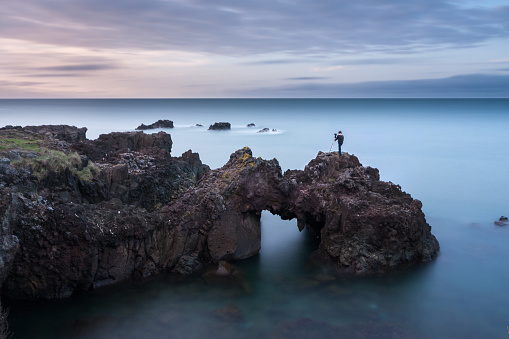 Sea long exposure, long exposure photo of man that can be photographed on cliffs. long exposure concept idea