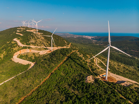 Wind power stations. Renewable energy and clean energy. Wind power is the use of air flow through wind turbines to mechanically power generators for electric power.