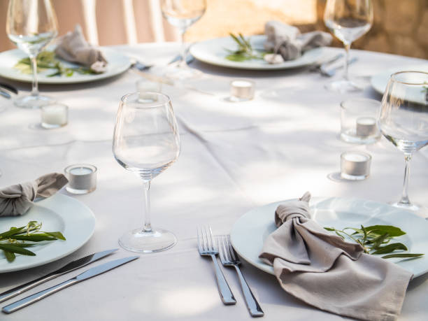 istock Table at luxury wedding reception event. Beautiful flowers on table and serving dishes and glasses and decoration 1678766719