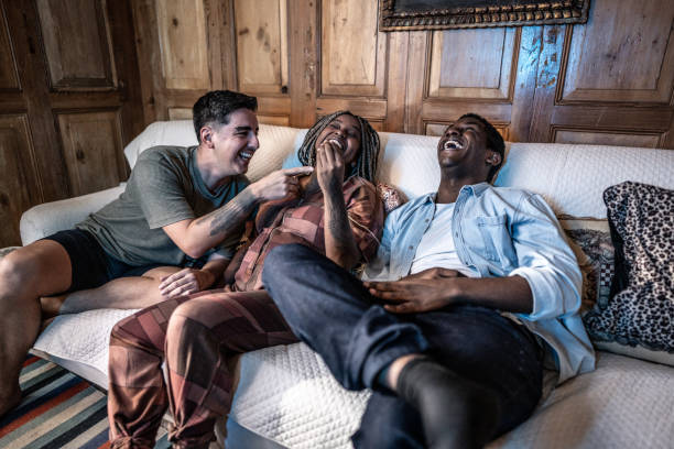 istock Friends talking and watching TV at home 1678779061