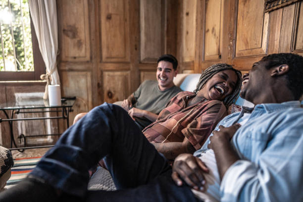istock Friends talking and watching TV at home 1678779081