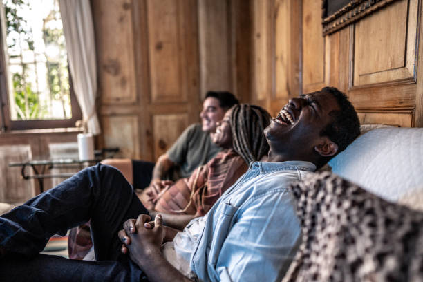 istock Young man watching TV with friends at home 1678779202