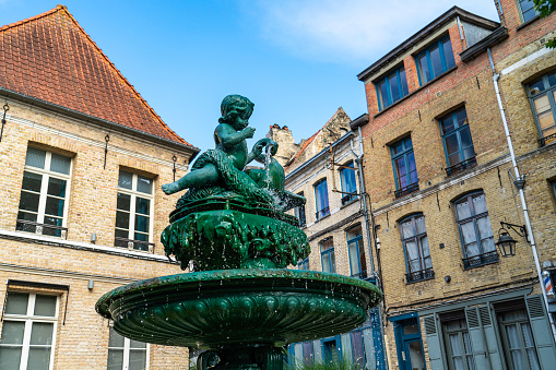 Ornate fountain in Rue Saint Bertin in Sanit Omer