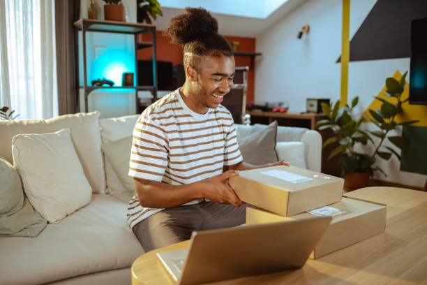 istock Male customer unpacking the package he ordered online. Online shopping 1678789266
