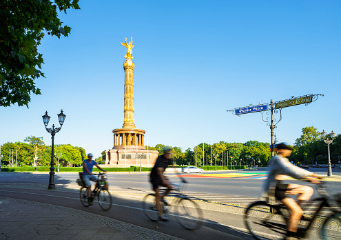 Bike commuters during sunset with Tiergarten park Berlin, Germany