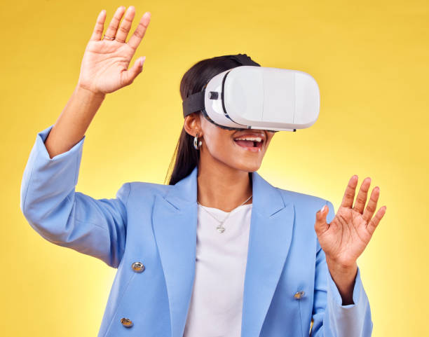 istock Business woman, virtual reality glasses and studio with hands, smile and 3d user experience by yellow background. Futuristic tech entrepreneur, ar vision and happy for metaverse, cyber ux or system 1678793658