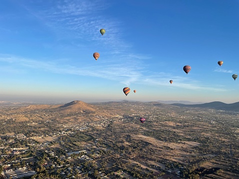 A hot air balloon flies near Goreme in Cappadocia, Turkey