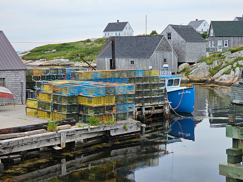 Peggy's Cove, NS, CAN, 8.15.2023 - A batch of lobster traps piled up at Peggy's Cove, Nova Scotia.