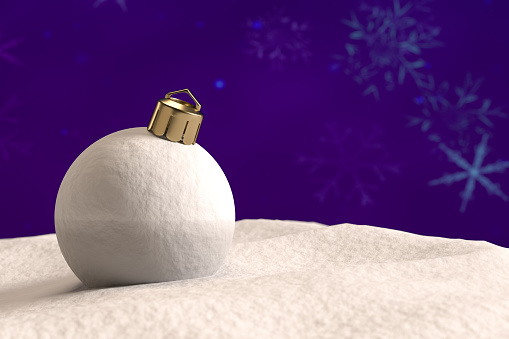 Christmas ball in snow on purple background. Digitally generated image.