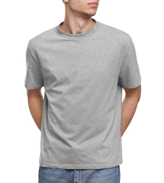 istock Young man wearing grey t-shirt on white background, closeup 1678873292