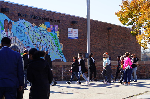 Milwaukee, Wisconsin USA - October 29th, 2022: Many Democrat voters lined up at North Division High school to participate at Governor Tony Evers, Mandela Barnes and Barack Obama Democratic party rally.